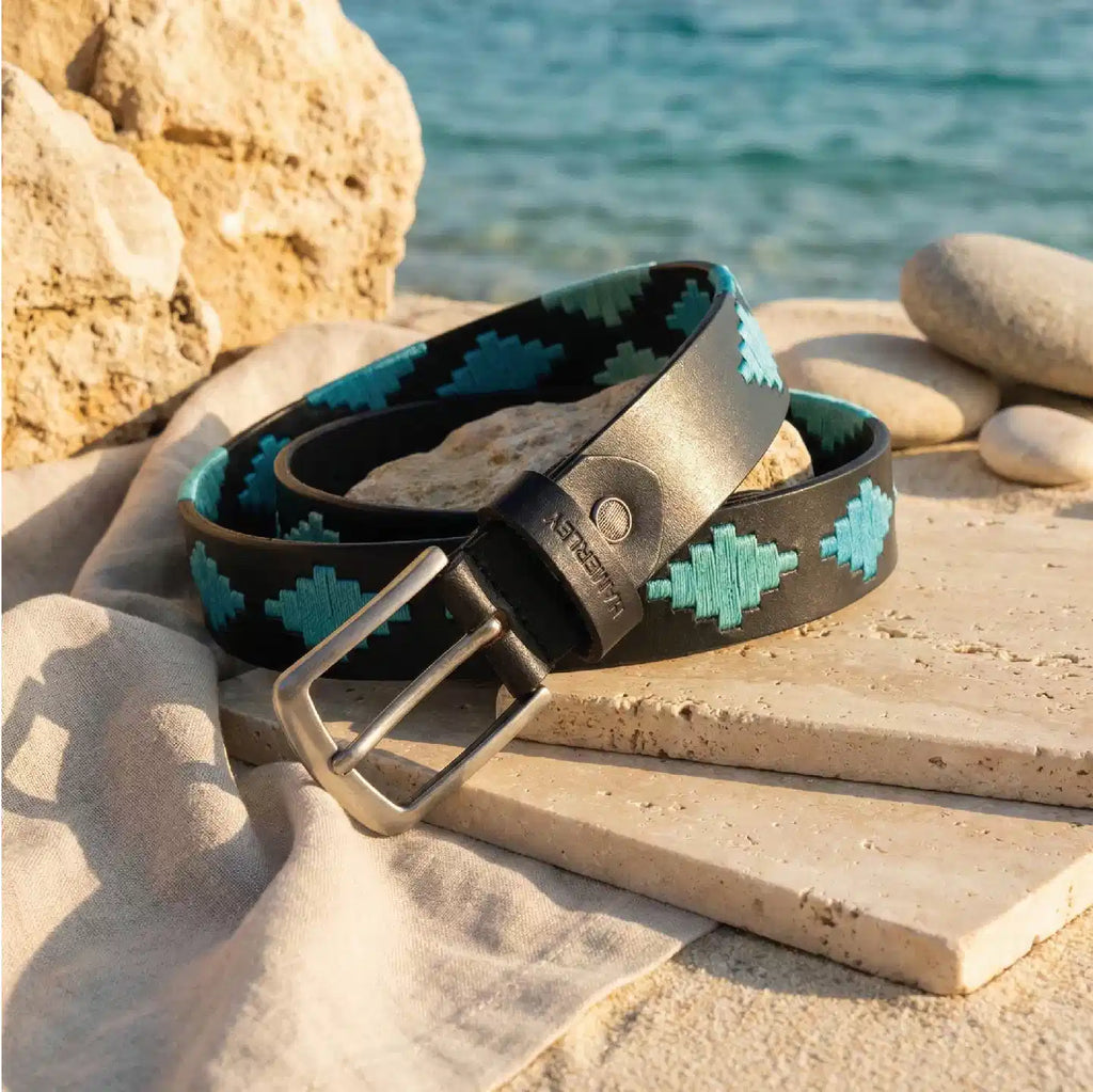 Hamerley Azure Crest polo belt – styled flat lay on neutral background showing full belt length and woven pattern